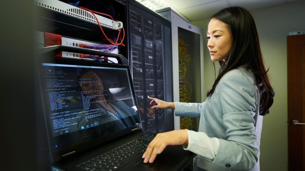 a woman in STEAM works in a computer server room Women with STEAM phase 1 confidence building courses