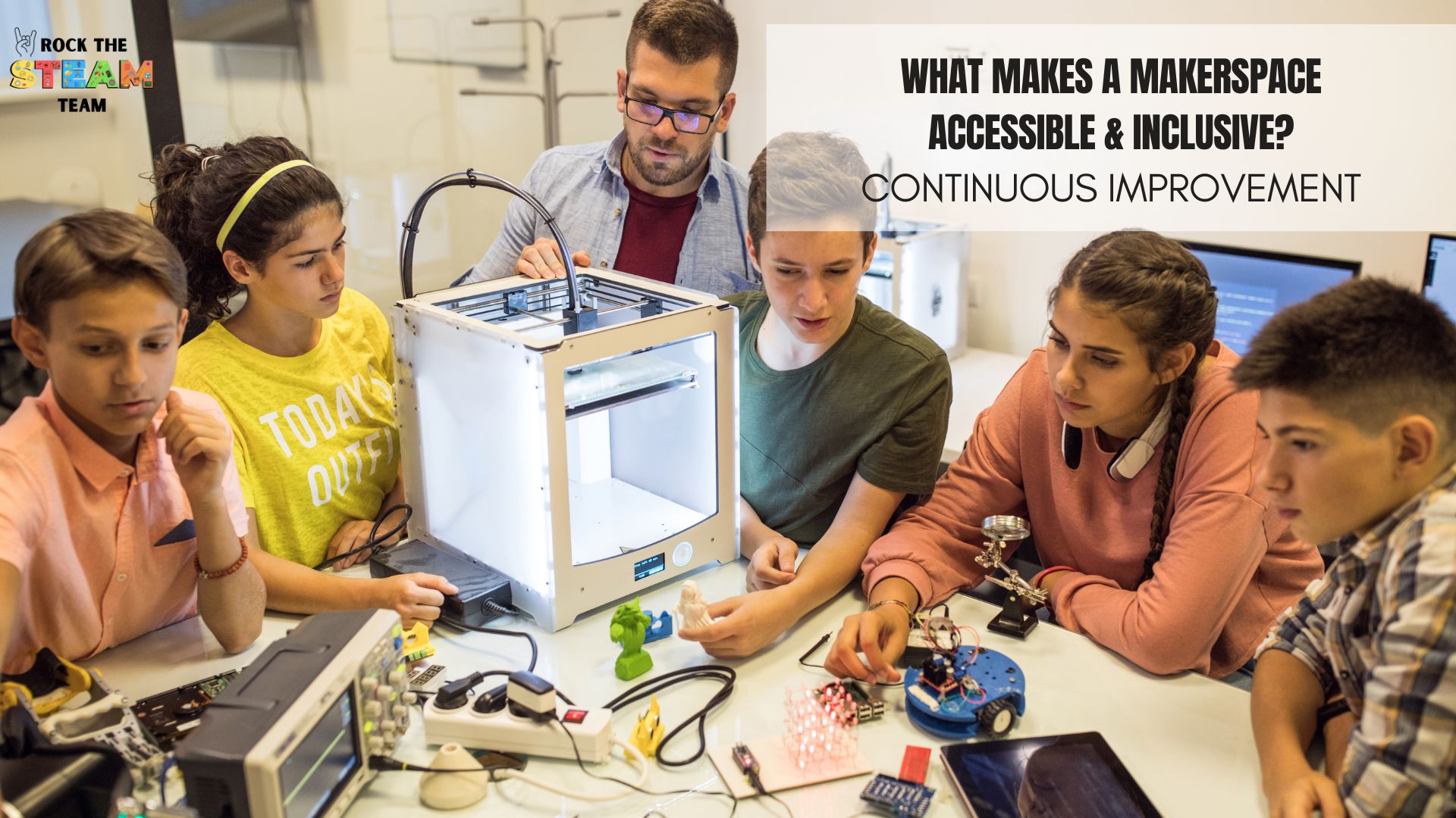 What is an Accessible and Inclusive Makerspace? - Rock the STEAM Team Inc. a group of people working on a 3d printer